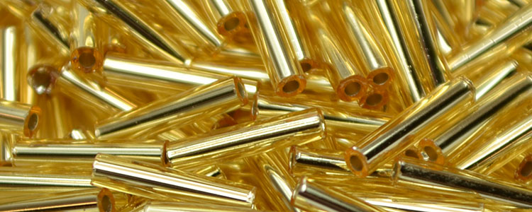TOHO 12mm Bugle-Light Topaz Silver Lined